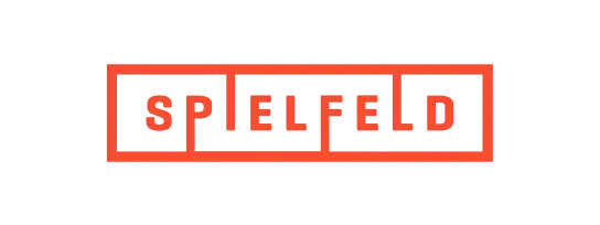 Spielfeld logo with red outlined text in a rectangular grid on a black background.