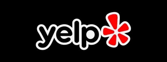 White "yelp" logo with a red asterisk next to it on a black background.